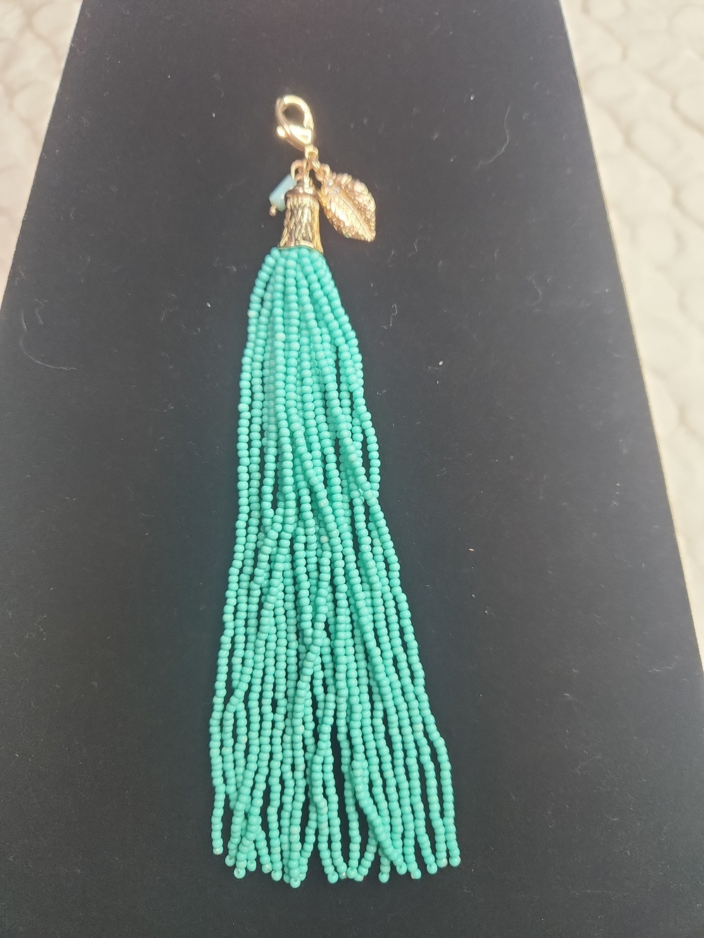 Turquoise Beaded Tassel Charm with Gold Leaf Accent